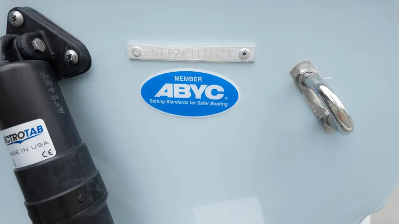 Slide: The Image of 2025 Tidewater 210CC boat with ABYC member sticker and trim tab. - 6