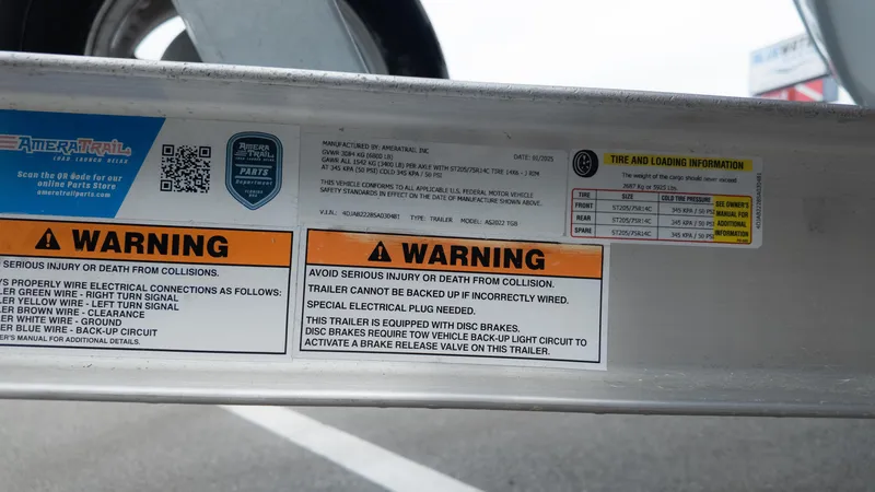 Slide: The Image of Warning labels and tire information on a 2025 Tidewater 210CC trailer. - 8