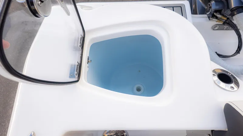 Slide: The Image of Open compartment on 2025 Tidewater 210CC boat, showcasing interior design and functionality. - 12