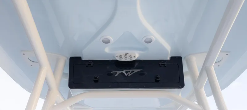 Slide: The Image of 2025 Tidewater 210CC boat underside view with storage compartment and lighting. - 15
