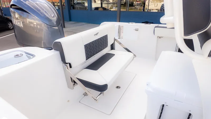 Slide: The Image of 2025 Tidewater 210CC boat interior with Yamaha engine and foldable seating. - 7