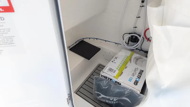 Slide: The Image of Interior of 2025 Tidewater 220cc boat with storage and equipment. - 15