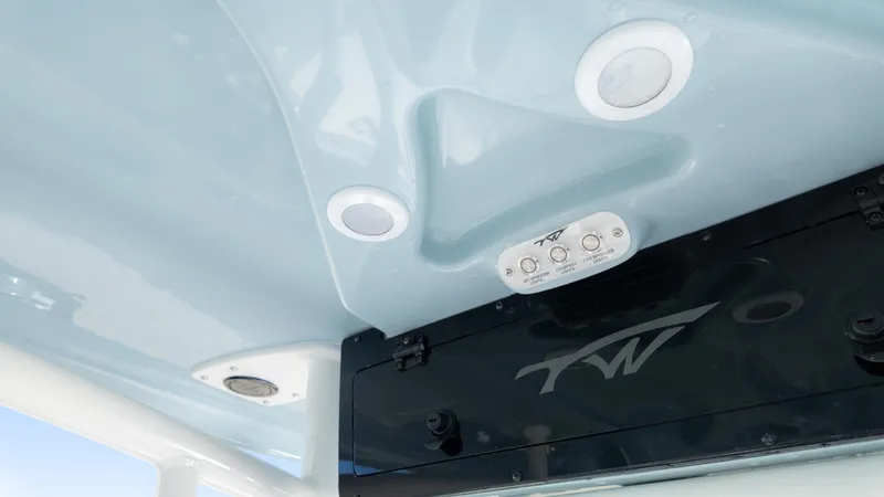 Slide: The Image of 2025 Tidewater 220cc boat interior ceiling with lighting and control panel. - 25