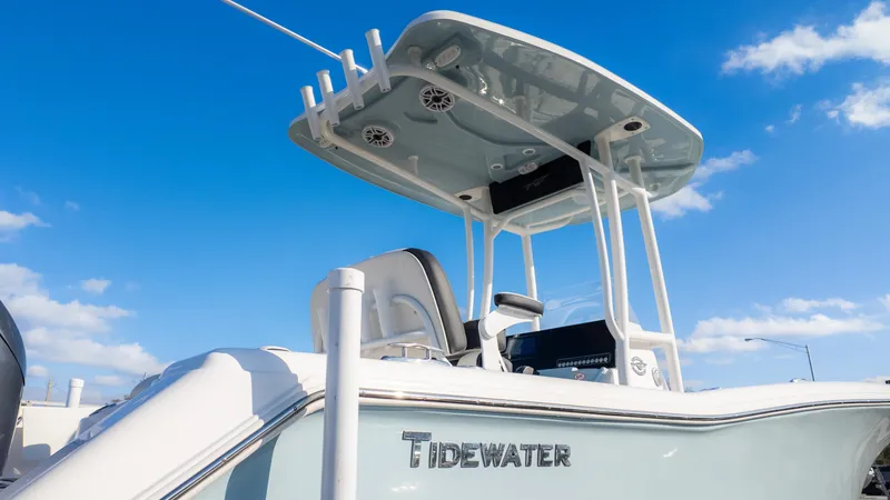 Slide: The Image of 2025 Tidewater 220cc boat under clear blue sky, showcasing sleek design and modern features. - 7