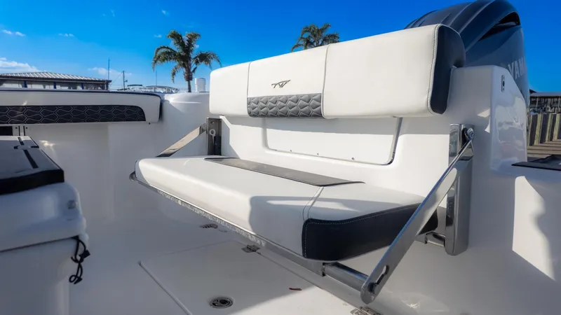 Slide: The Image of 2025 Tidewater 220cc boat interior with foldable seating and modern design. - 8