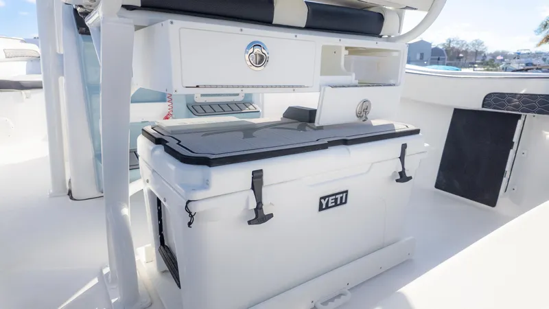 Slide: The Image of 2025 Tidewater 220cc boat interior with Yeti cooler and storage compartments. - 9