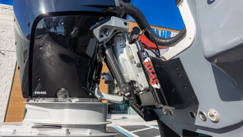 Slide: The Image of 2025 Tidewater 2500 Carolina Bay boat engine close-up with Atlas hydraulic jack plate. - 10