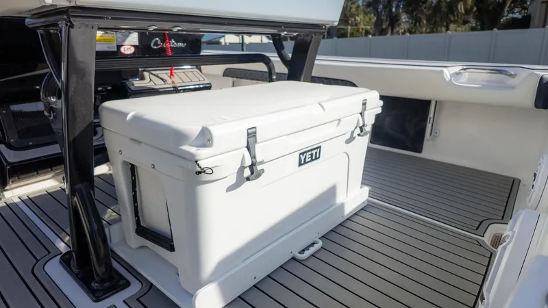 Slide: The Image of 2025 Tidewater 2500 Carolina Bay boat interior with Yeti cooler on deck. - 17