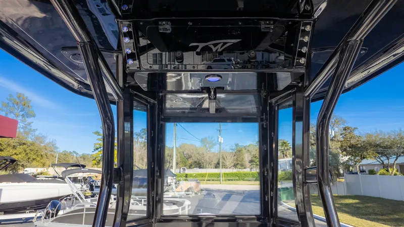 Slide: The Image of 2025 Tidewater 2500 Carolina Bay boat interior with sleek black framework and modern design. - 20
