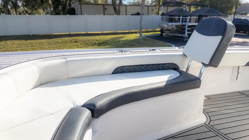Slide: The Image of 2025 Tidewater 2500 Carolina Bay boat interior with white and black seating. - 28
