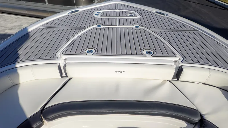 Slide: The Image of 2025 Tidewater 2500 Carolina Bay boat deck with cushioned seating and sleek design. - 30