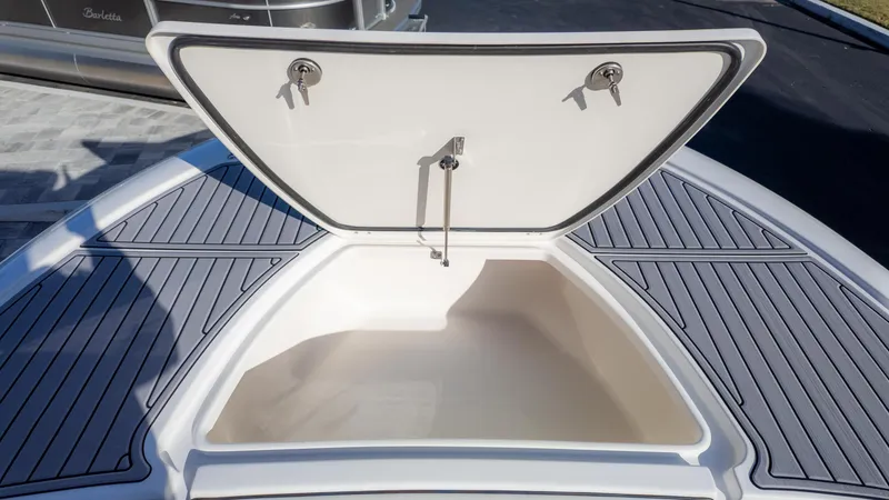Slide: The Image of Open storage compartment on 2025 Tidewater 2500 Carolina Bay boat deck. - 32