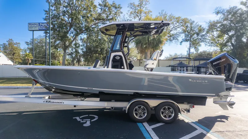 Slide: The Image of 2025 Tidewater 2500 Carolina Bay boat on trailer, parked outdoors. - 5
