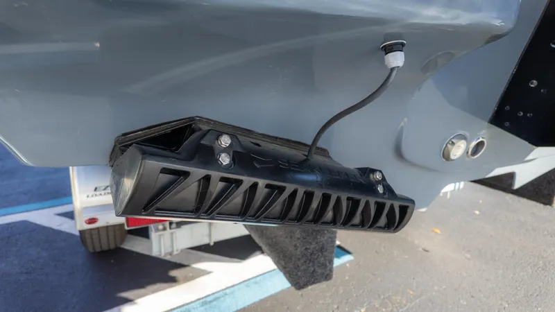 Slide: The Image of 2025 Tidewater 2500 Carolina Bay boat transom with mounted equipment and wiring. - 9