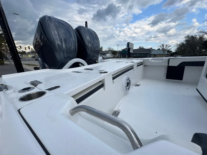 Slide: The Image of 2025 Tidewater 2700 Carolina Bay boat interior with dual engines, spacious deck, and modern features. - 10