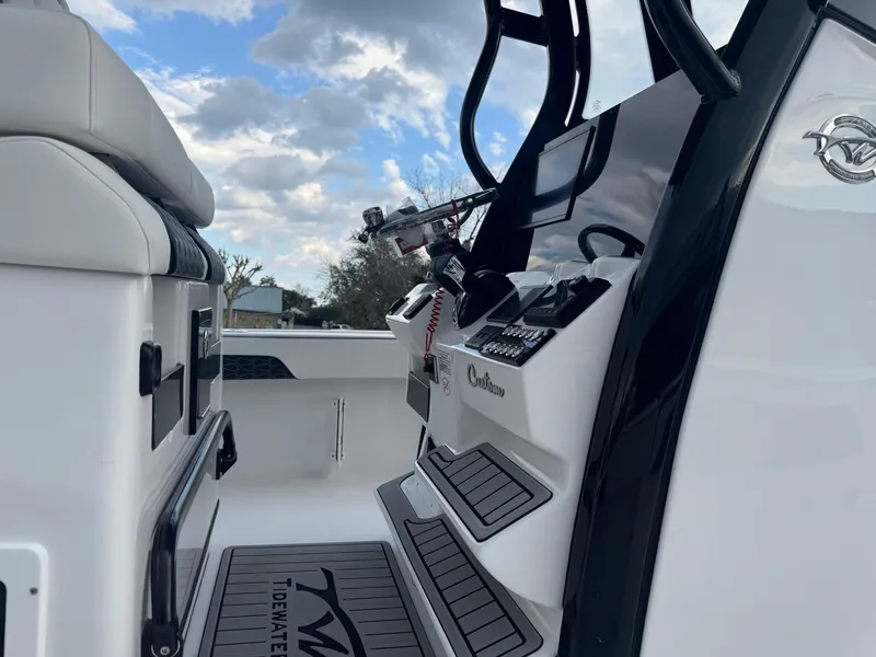 Slide: The Image of 2025 Tidewater 2700 Carolina Bay boat interior with modern controls and seating. - 11