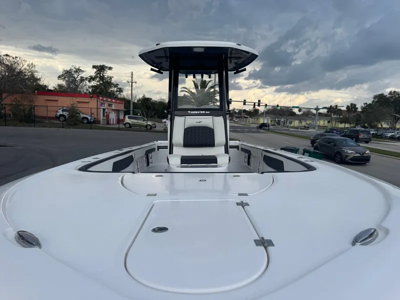 Slide: The Image of 2025 Tidewater 2700 Carolina Bay boat on a street, cloudy sky background. - 15
