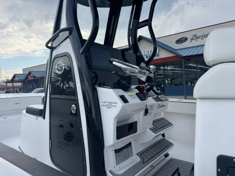 Slide: The Image of 2025 Tidewater 2700 Carolina Bay boat interior with modern console and seating. - 18