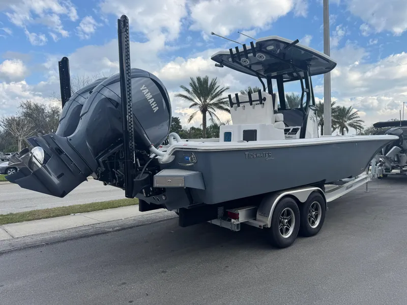 Slide: The Image of 2025 Tidewater 2700 Carolina Bay boat with Yamaha engine on a trailer, parked outdoors. - 3