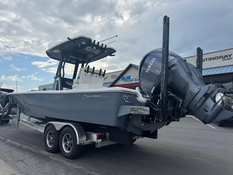Slide: The Image of 2025 Tidewater 2700 Carolina Bay boat on trailer with Yamaha engine, parked outdoors. - 7