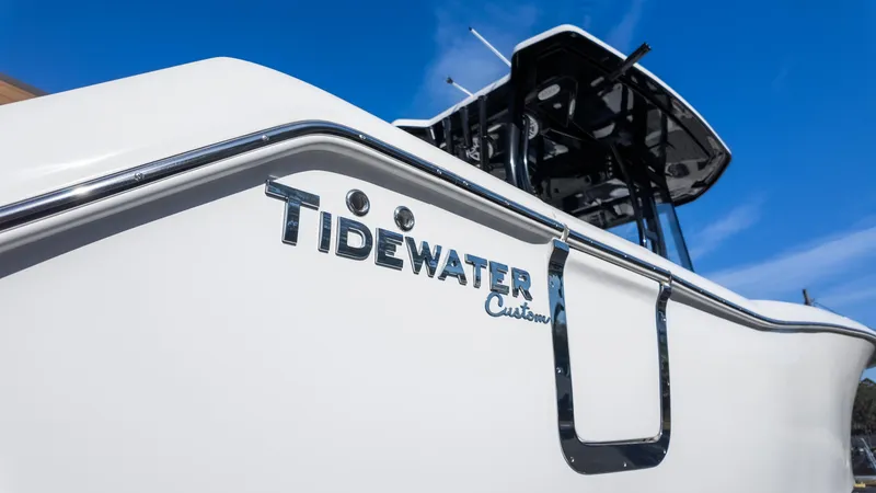 Slide: The Image of 2025 Tidewater 282CC boat, sleek design, blue sky background. - 10
