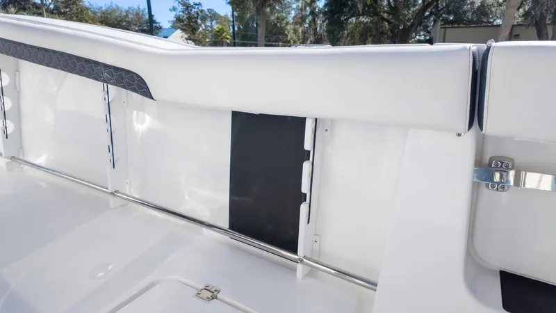 Slide: The Image of 2025 Tidewater 282CC boat interior with sleek white seating and modern design elements. - 18