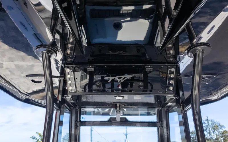 Slide: The Image of 2025 Tidewater 282CC boat interior with sleek black design and modern features. - 21