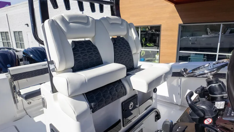 Slide: The Image of 2025 Tidewater 282CC boat interior with luxurious seating and modern controls. - 22