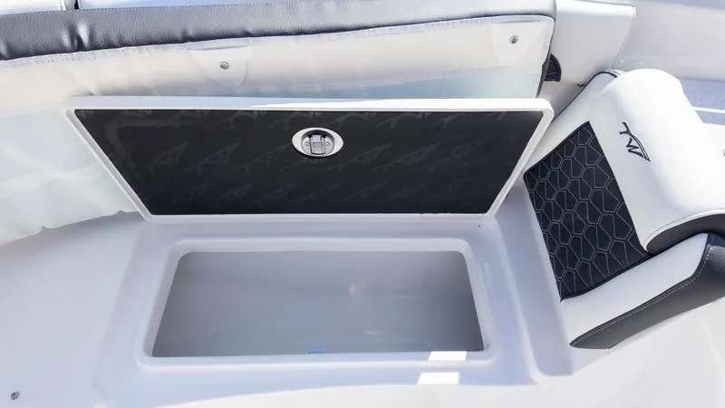 Slide: The Image of 2025 Tidewater 282CC boat storage compartment with cushioned seating and sleek design. - 25