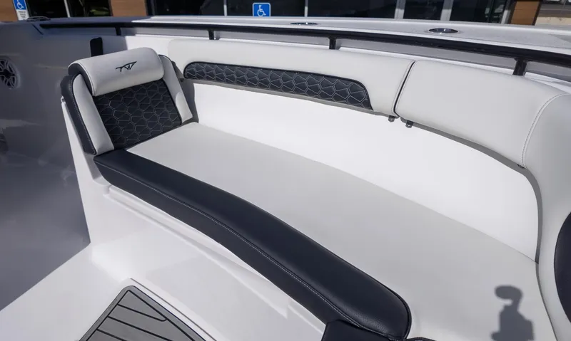 Slide: The Image of 2025 Tidewater 282CC boat interior seating with black and white upholstery. - 27