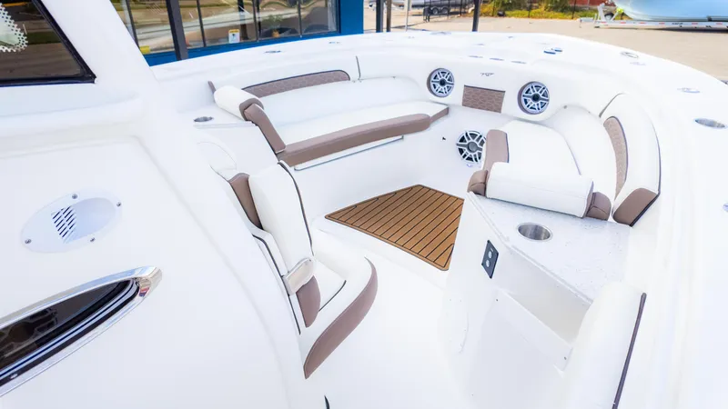 Slide: The Image of 2025 Tidewater 282CC boat interior with cushioned seating and modern design. - 12