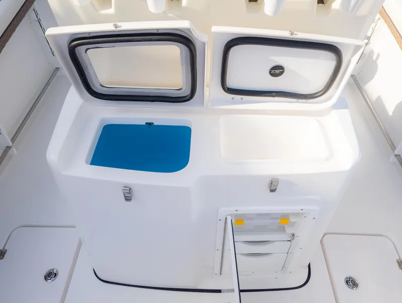 Slide: The Image of 2025 Tidewater 282CC boat storage compartments and utility area. - 17