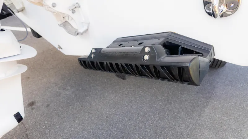 Slide: The Image of 2025 Tidewater 282CC boat detail showing a black trim tab on the hull. - 9