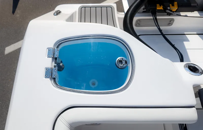 Slide: The Image of 2025 Tidewater 320cc boat detail with blue hatch and sleek design. - 14