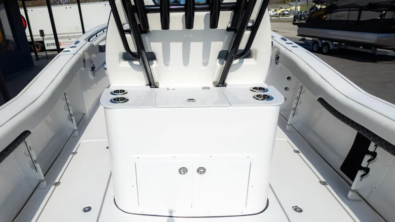 Slide: The Image of 2025 Tidewater 320cc boat interior with seating and storage compartments. - 16
