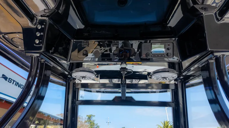 Slide: The Image of Interior view of 2025 Tidewater 320cc boat's control panel and electronics. - 22