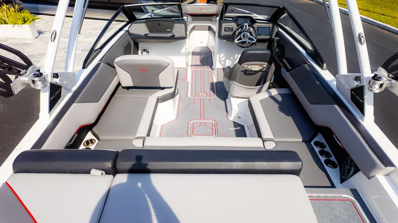 Slide: The Image of 2024 Cobalt CS23 Surf boat interior with sleek seating and modern dashboard design. - 10