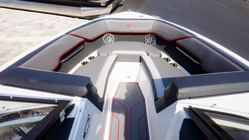 Slide: The Image of 2024 Cobalt CS23 Surf boat interior with sleek seating and modern design. - 12