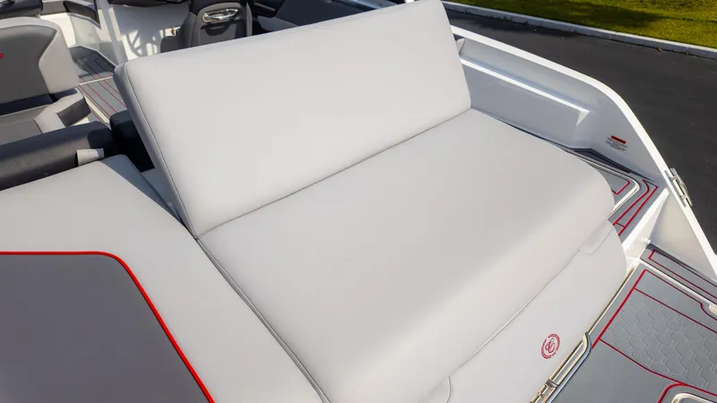 Slide: The Image of 2024 Cobalt CS23 Surf boat interior with white cushioned seating. - 17