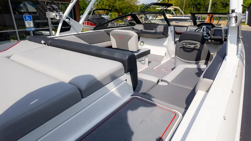 Slide: The Image of 2024 Cobalt CS23 Surf boat interior with sleek seating and modern design. - 19
