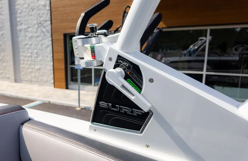 Slide: The Image of 2024 Cobalt CS23 Surf boat control panel with lock mechanism, featuring sleek design elements. - 20
