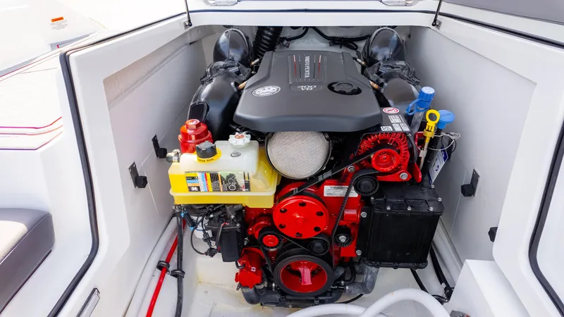 Slide: The Image of 2024 Cobalt CS23 Surf engine compartment showcasing powerful marine engine components. - 25