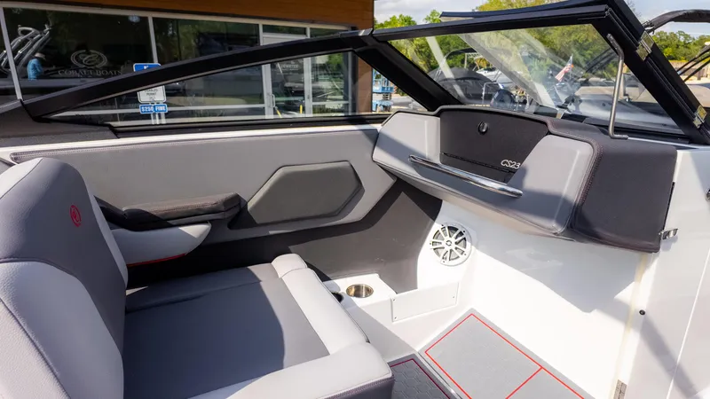 Slide: The Image of 2024 Cobalt CS23 Surf boat interior with sleek seating and modern dashboard design. - 30