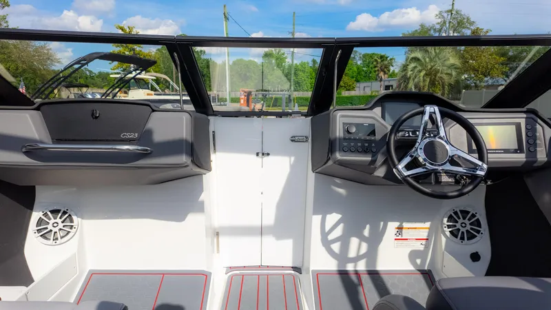 Slide: The Image of 2024 Cobalt CS23 Surf boat interior with modern dashboard and steering wheel. - 37