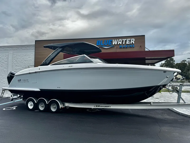Slide: The Image of 2025 Cobalt R33 boat on trailer at Bluewater Marine dealership. - 1