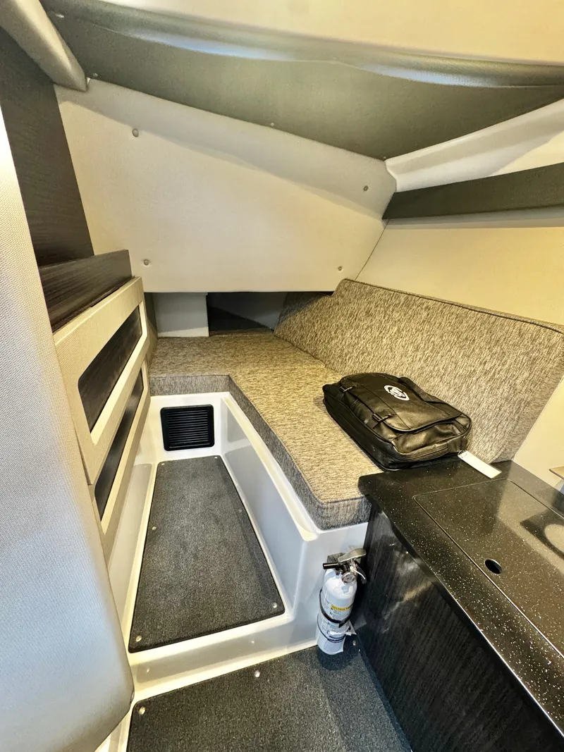 Slide: The Image of Interior of 2025 Cobalt R33 boat cabin with seating and storage. - 18