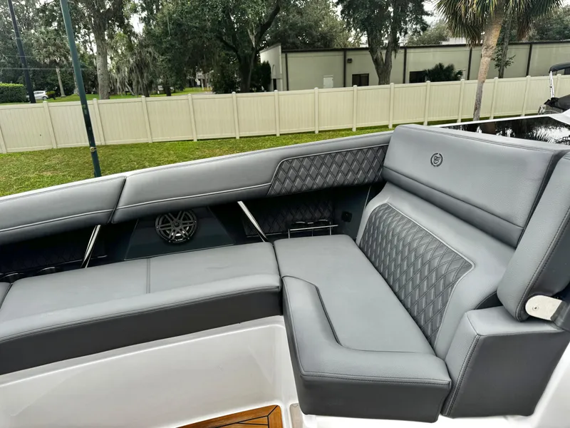 Slide: The Image of Luxurious seating on 2025 Cobalt R33 boat with diamond-stitched upholstery and integrated speaker. - 21