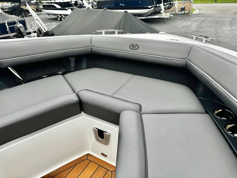 Slide: The Image of Luxurious seating area on 2025 Cobalt R33 boat with gray upholstery and cup holders. - 23