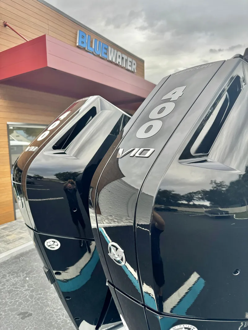 Slide: The Image of Outboard motors at Bluewater dealership, featuring sleek black design and V10 engine branding. - 27
