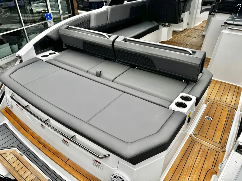 Slide: The Image of Luxurious seating on 2025 Cobalt R33 boat with sleek design and wooden flooring. - 9